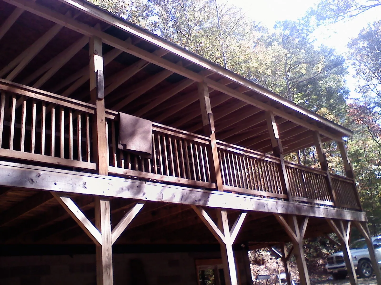 Timber framing under a new elevated porch and deck — Roof Leak Repair in Warrensburg by Roofing Brothers